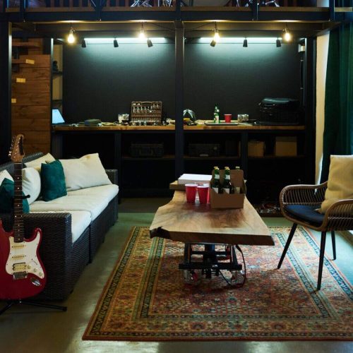 Part of garage or room inside house with table standing in the center